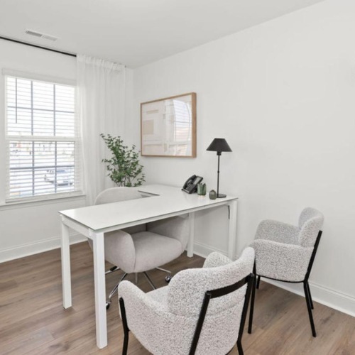 a room with a table and chairs