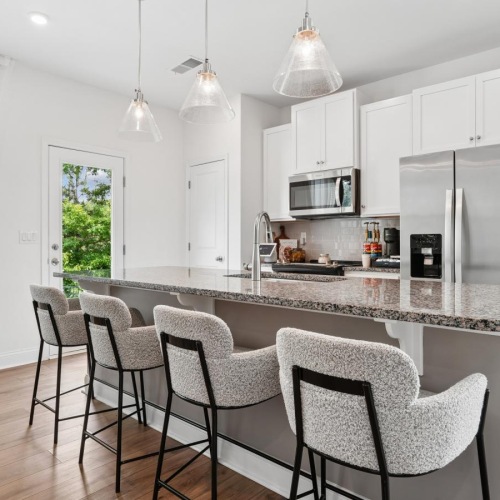 a kitchen with white cabinets