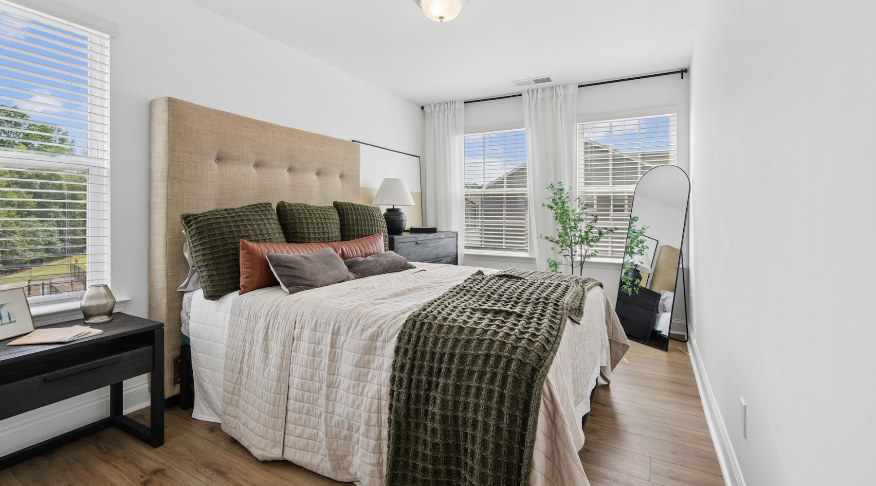 Bedroom with natural lighting and high ceilings